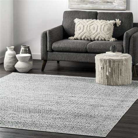 New and innovative one-piece machine washable rug with the backing layer attached. . Nuloom washable rug